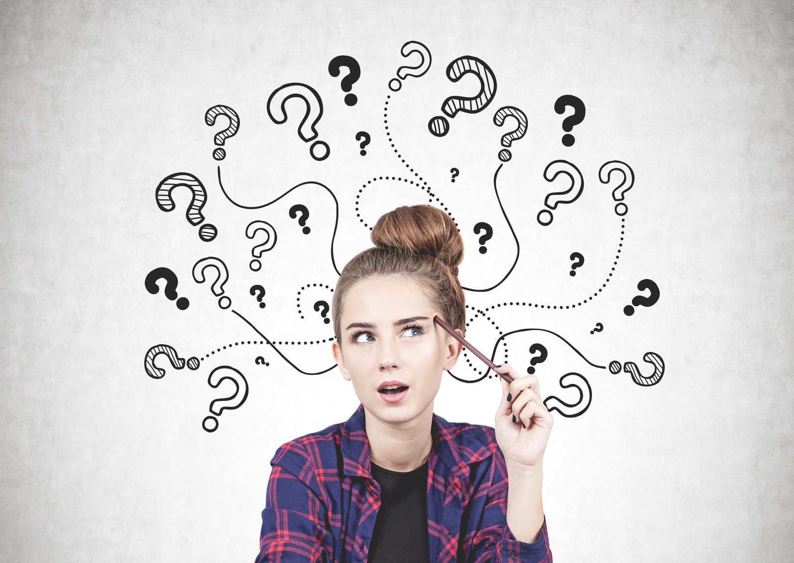 Thinking teen girl, question marks